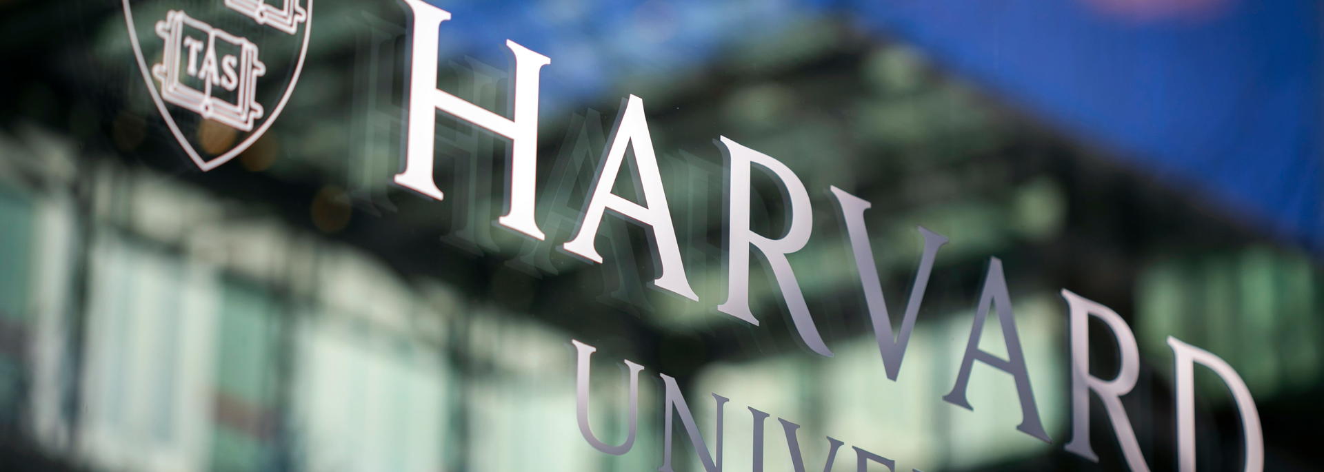 Harvard University name on glass building